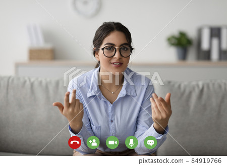 Pov screenshot of young arab female psychologist giving online consultation, talking with client remotely and gesturing Pov screenshot of young arab female psychologist giving online consultation, talking with client remotely and gesturing 84919766