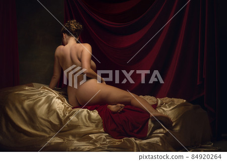Modern remake of classical artwork with young medieval girl on dark background. Renaissance style concept Modern remake of classical artwork with young medieval girl on dark background. Renaissance style concept 84920264