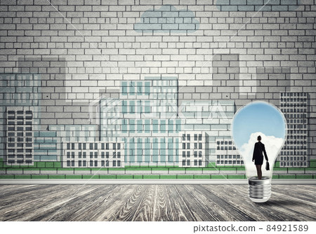 Businesswoman trapped in bulb Businesswoman trapped in bulb 84921589