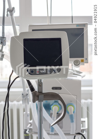Video laryngoscope , on background medical ventilator in ICU in hospital. Video laryngoscope , on background medical ventilator in ICU in hospital. 84921915