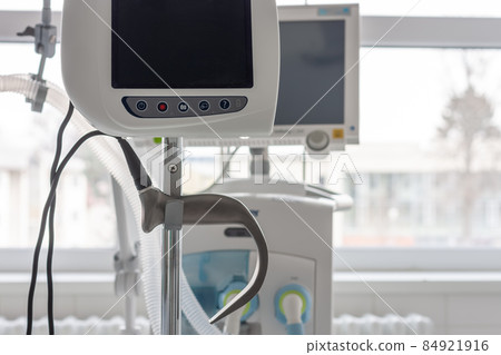 Video laryngoscope , on background medical ventilator in ICU in hospital. 84921916