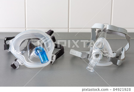 Two types of non-invasive ventilation face mask, close up view, in ICU in hospital. 84921928