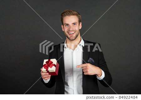 happy businessman point finger on business reward for occasion greeting 84922484