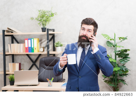 Caffeine addicted. Man bearded businessman hold cup Caffeine addicted. Man bearded businessman hold cup 84922663
