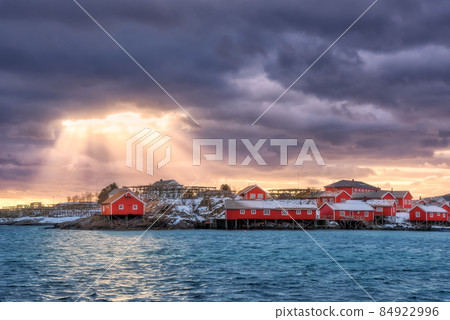Norwegian fishing village and sea coast at sunset 84922996
