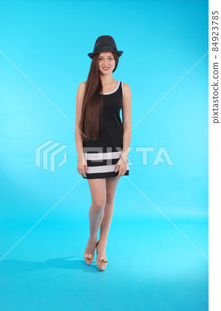 Beautiful young girl in black hat on his head Beautiful young girl in black hat on his head 84923785