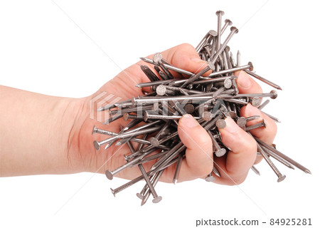 Man's hand holding metal nails (Clipping path) Man's hand holding metal nails (Clipping path) 84925281