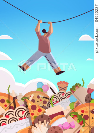 woman hanging rope above junk food assortment of fast food unhealthy nutrition junkfood addiction concept 84930227