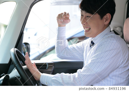 Image of a businessman driving dangerously Image of a businessman driving dangerously 84931196