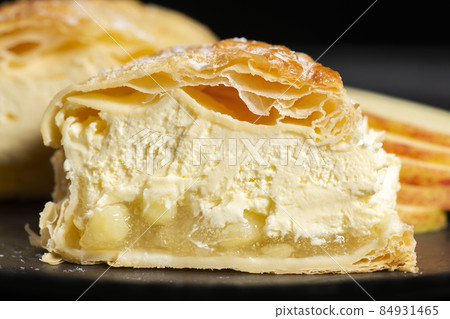 Apple turnover with fresh whipped cream 84931465