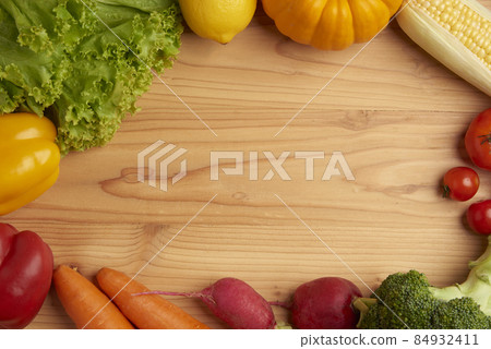 vegetable concept various vegetables such as lettuces, lemons, pumpkins, corns, tomatoes, broccolis, beetroots, bell peppers and carrots being put on the wooden table 84932411