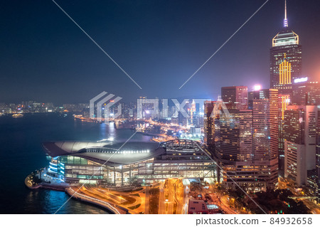Skyline of skyscrapers in Wan Chai at dusk, with the Hong Kong Convention & Exhibition Centre, 11 Dec 2019 84932658