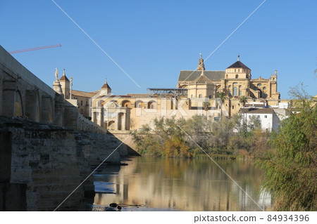 Roman Bridge leading from the Puente Gate towering over Triunfo (Victory Square) 84934396