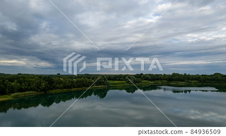 Aerial photo taken with a drone of a dark ominous grey storm clouds. Dramatic sky. lighting in dark Aerial photo taken with a drone of a dark ominous grey storm clouds. Dramatic sky. lighting in dark 84936509