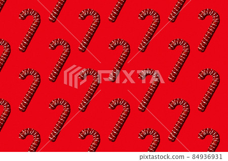 Christmas holiday pattern. Red canes on red background. Christmas holiday pattern. Red canes on red background. 84936931