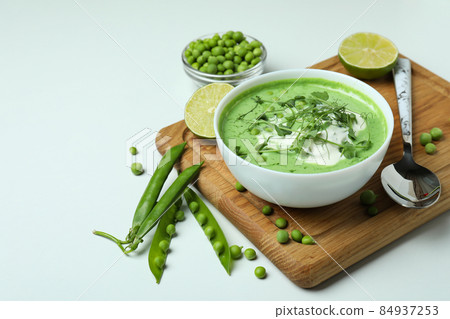 Concept of tasty eating with pea soup on white background 84937253
