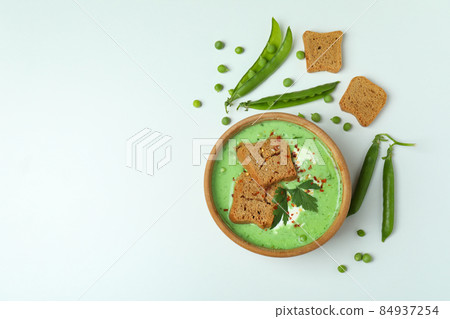 Concept of tasty eating with pea soup on white background 84937254