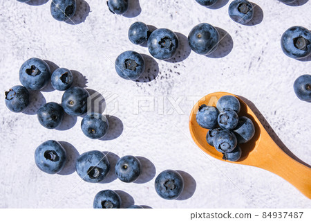 Fresh blueberries background with copy space . Blueberry antioxidant organic superfood in wooden spoon concept for healthy eating and nutrition. Harvesting concept Fresh blueberries background with copy space . Blueberry antioxidant organic superfood in wooden spoon concept for healthy eating and nutrition. Harvesting concept 84937487