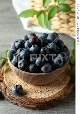 Fresh berry concept with blueberry on gray textured table Fresh berry concept with blueberry on gray textured table 84937547