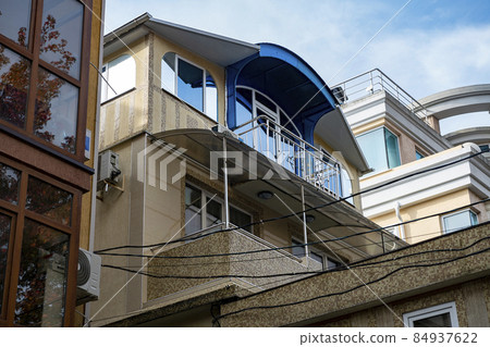 Facade of a hotel building in a summer resort town. 84937622