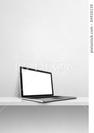 Laptop computer on white concrete shelf. Vertical background 84938139
