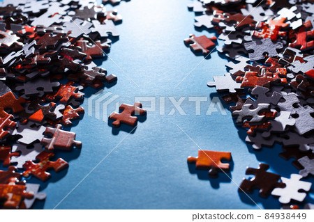 Colorful Jigsaw Puzzle on Blue Background Colorful Jigsaw Puzzle on Blue Background 84938449
