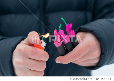 Guy Sets Fire to the Flash Noise Firecrackers Outdoors 84938471