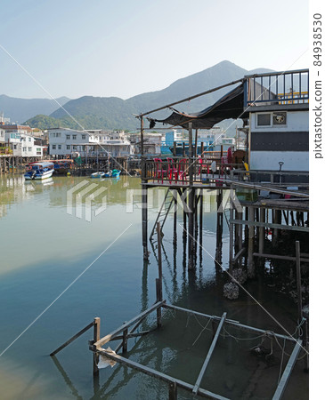 Vertical traditional Hong Kong old wooden house, boat and river in countryside Vertical traditional Hong Kong old wooden house, boat and river in countryside 84938530