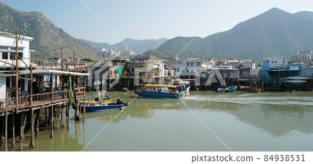 wide photography traditional Hong Kong old wooden house, boat and river in countryside wide photography traditional Hong Kong old wooden house, boat and river in countryside 84938531