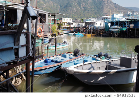 Traditional Hong Kong old wooden house, boat and river in countryside 84938535