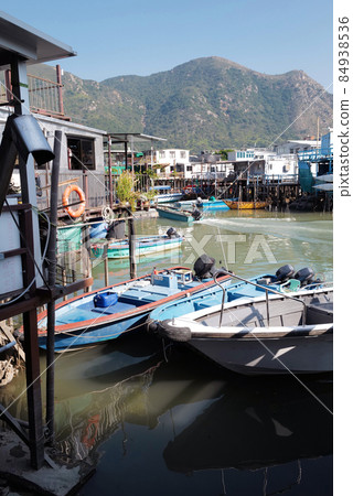 Vertical traditional Hong Kong old wooden house, boat and river in countryside 84938536