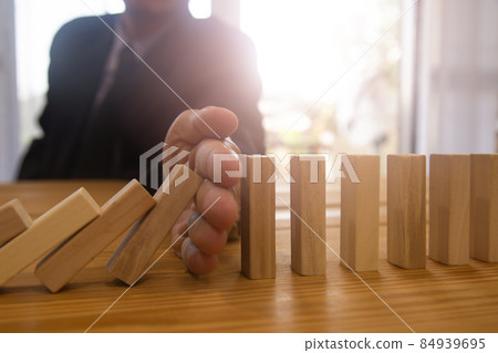 Business man gambling placing wooden block. Business concept  investment target and growth success process background present financial information planning, risk and marketing strategy analysis. 84939695