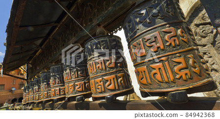 Tibetan copper prayer wheels, Swayambhunath Temple, Kathmandu, Nepal 84942368