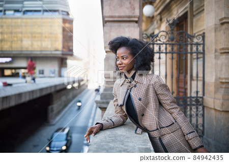 Beautiful African American woman, urban street portrait 84942435