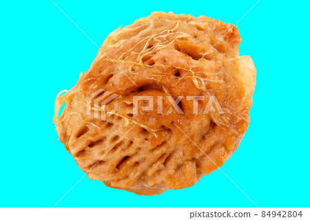 wet peach seed isolated on turquoise background wet peach seed isolated on turquoise background 84942804