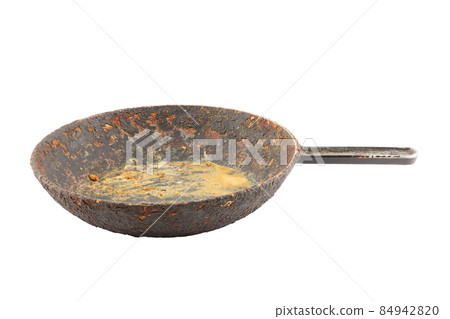 old disgusting stained rusty cast iron pan with burnt fat and food leftovers isolated old disgusting stained rusty cast iron pan with burnt fat and food leftovers isolated 84942820