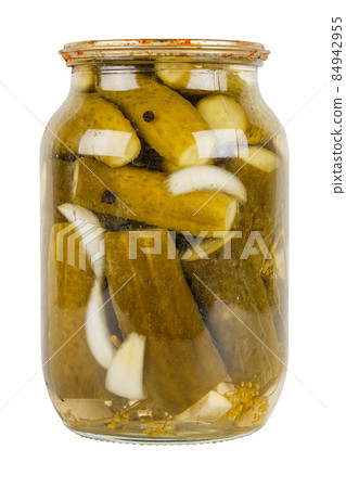 pickles marinade in glass jar with rusted cap isolated on white background pickles marinade in glass jar with rusted cap isolated on white background 84942955
