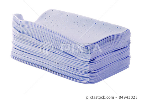 stack of purple liquidless and powderless laundry detergent squares sheets isolated on white background 84943023