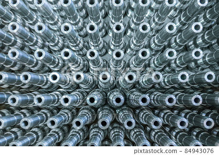 Shiny long steel parts full frame background, clean steel rods after fine cnc turning. 84943076