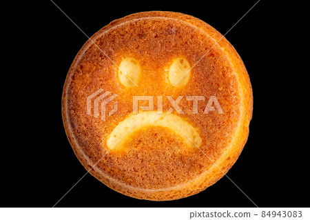 unhappy face biscuit cookie isolated on black in flat lay perspective unhappy face biscuit cookie isolated on black in flat lay perspective 84943083