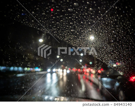 defocused photo of night driver view on city from right steering car 84943140