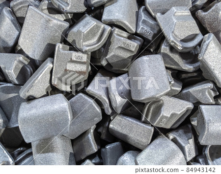 heap of gray steel forgings after shot blasting - close-up natural heavy industrial pattern with selective focus heap of gray steel forgings after shot blasting - close-up natural heavy industrial pattern with selective focus 84943142