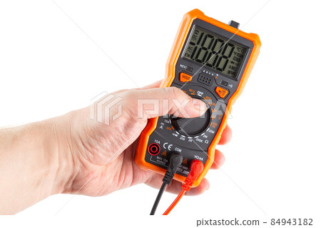lcd screen digital electrical multimeter in left hand, isolated on white background, mockup with all on 84943182