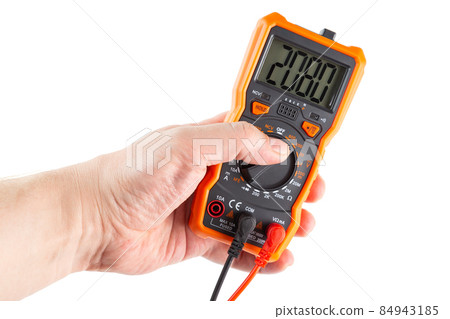 digit 2080 on lcd screen of digital electrical multimeter in left hand, isolated on white background 84943185