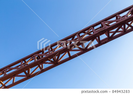 straight red steel welded truss on blue sky background straight red steel welded truss on blue sky background 84943283