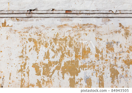Shabby flat plaster and painted wall with big yellow under layer spots Shabby flat plaster and painted wall with big yellow under layer spots 84943505