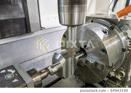 unadorned photo of automated milling metal part on cnc machine unadorned photo of automated milling metal part on cnc machine 84943599