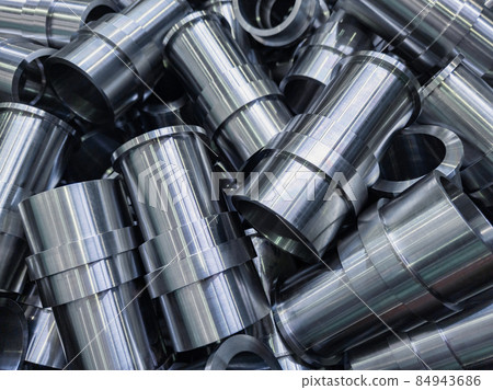 abstract industrial shiny steel production background with cnc machined pipes - selective focus and lens blur technique 84943686