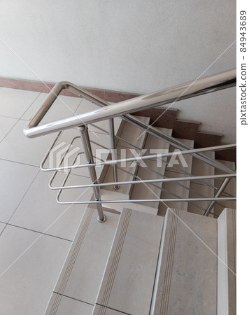 modern design of stanless steel pipes handrail and ceramic tiles staircase in abstract public building modern design of stanless steel pipes handrail and ceramic tiles staircase in abstract public building 84943689