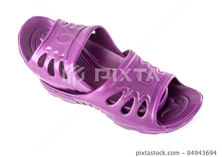 pair of cheap durable pink rubber slippers one inside other isolated on white background. 84943694
